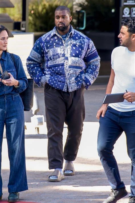 kanye west wearing gucci slides